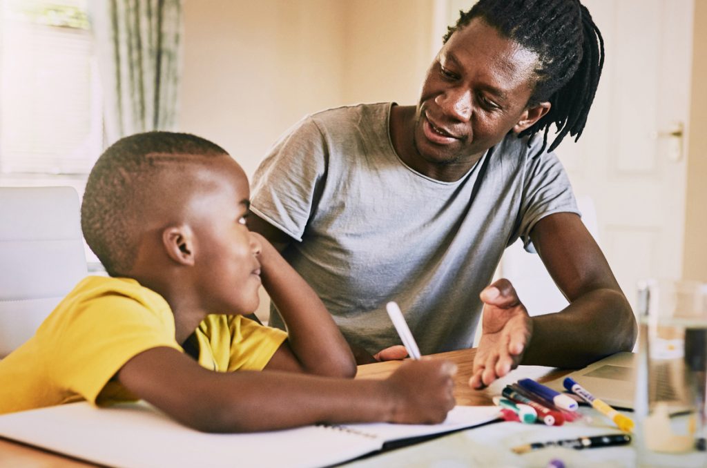 Cropped shot of an affectionate young single father helping his son with his homework at home