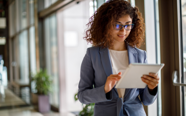 business professional on tablet reading