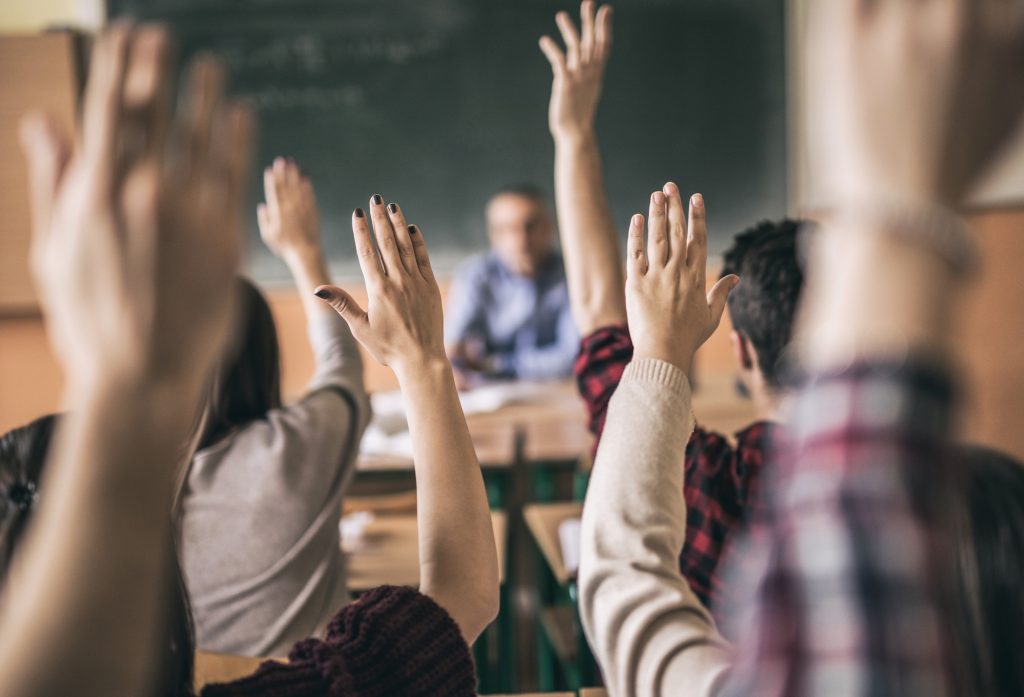 Every student with their hand raised