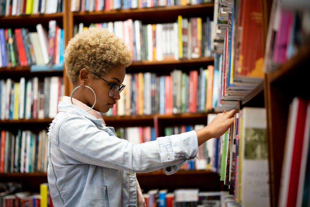 Woman picking out a book