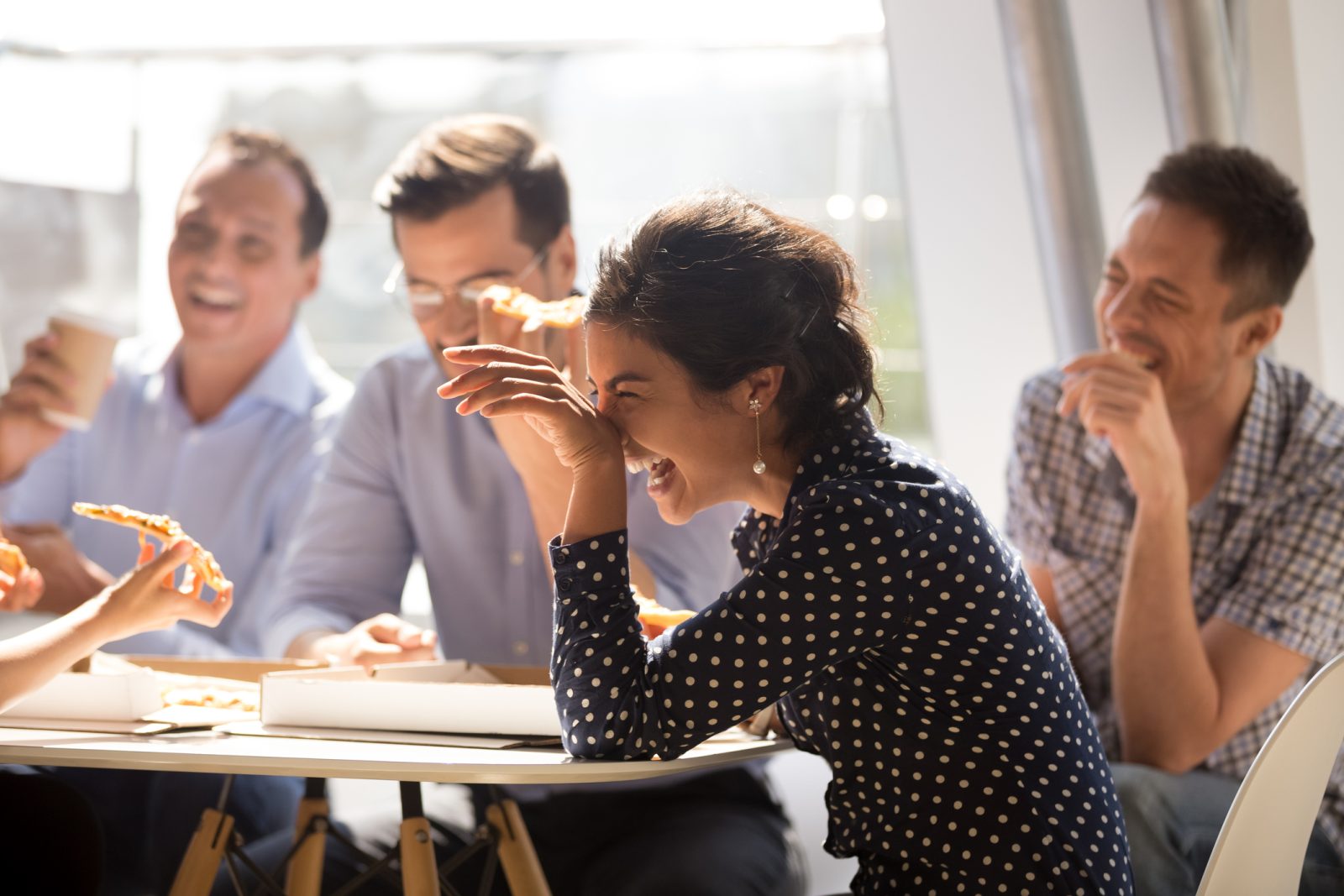 Coworkers laughing with each other on break