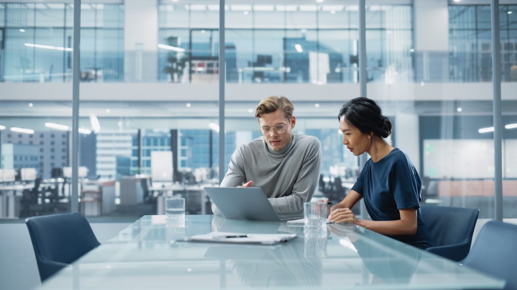 office workers discussing innovation.