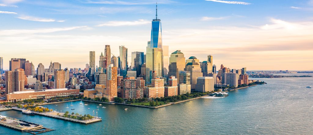 Aerial view with Lower Manhattan skyline at sunset viewed from above Hudson River