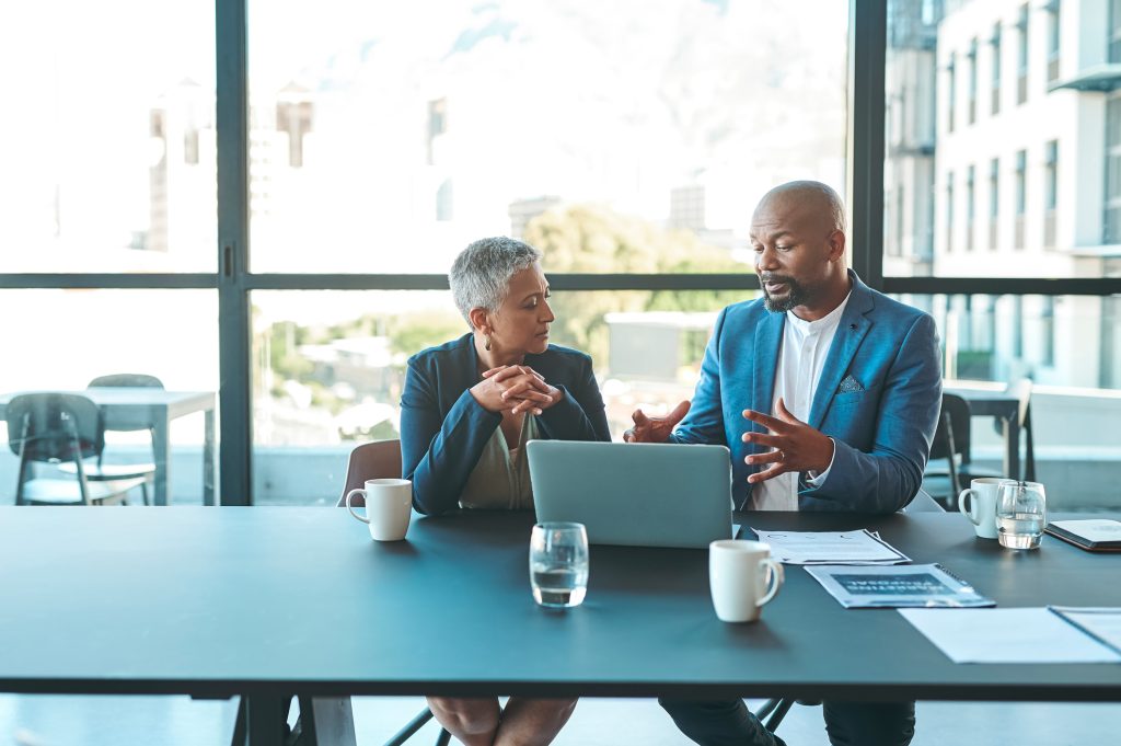 Business, presentation with man on a laptop in a corporate conference with a woman at work.