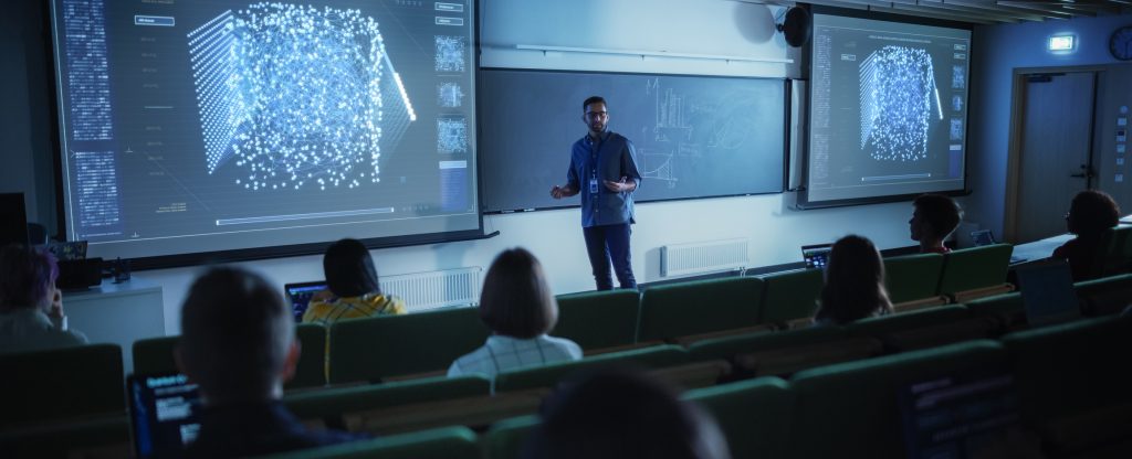 Young University Professor Explaining the Importance of Artificial Intelligence to a Group