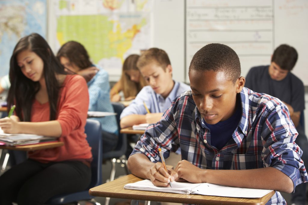 students in classroom taking tests