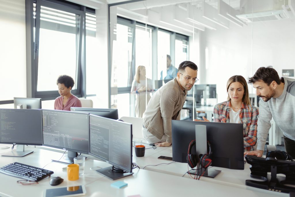 employees reviewing AI policies on computers