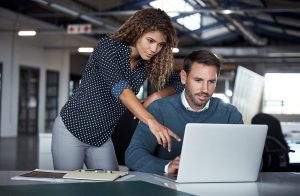 people looking at curriculum content on computer