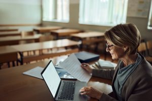 women using Rightfind Curriculum on school laptop