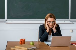 teacher using computer rightfind curriculum