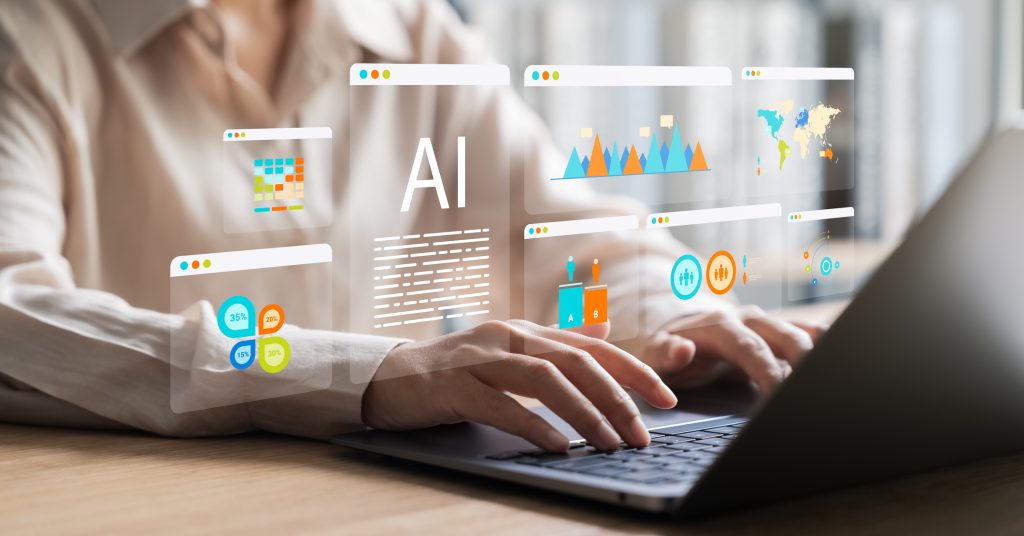 women using AI on computer at desk