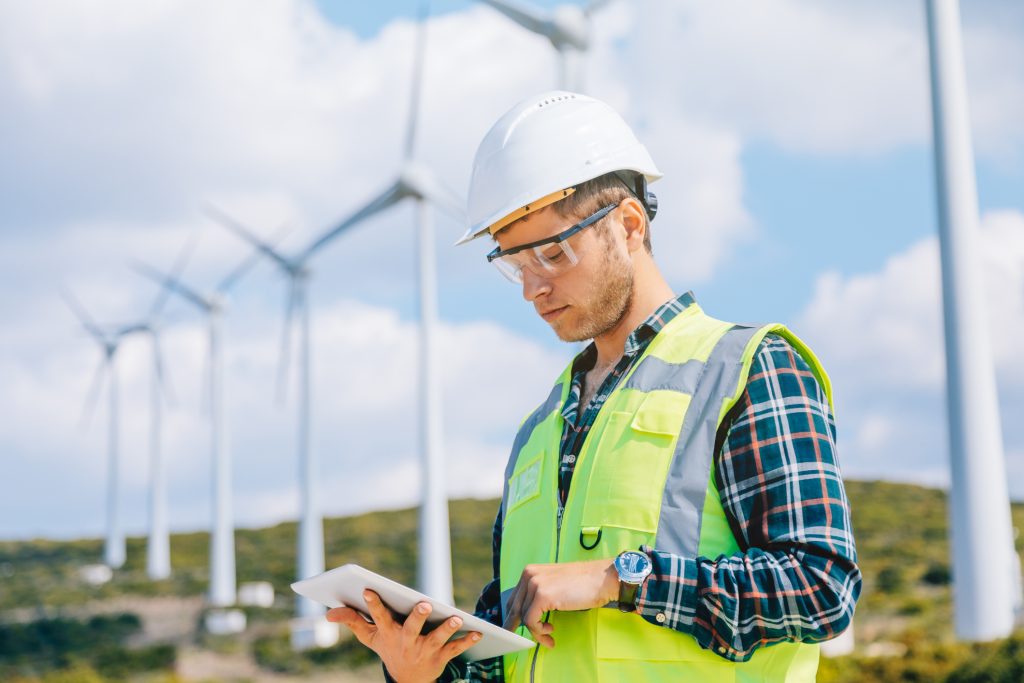 employee of energy company engineering on tablet