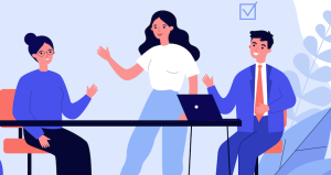 employees talking and working at desk