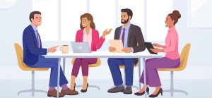 employees discussing business at desk