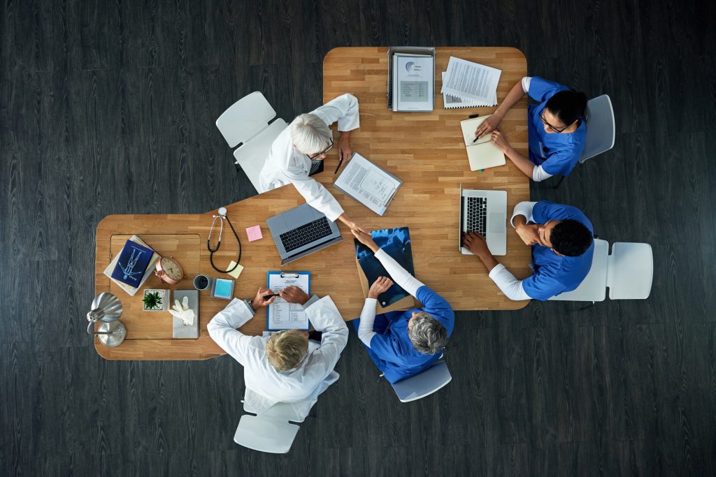 bird's eye view of medical team working at table
