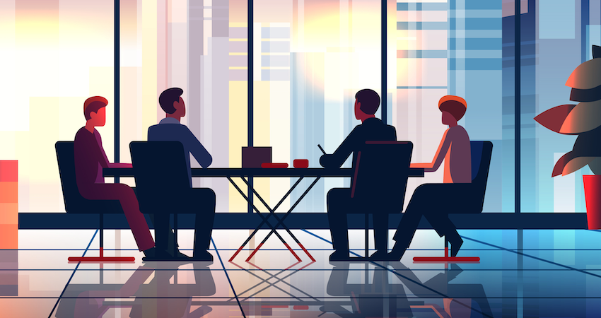 employees meeting in conference room to talk about business