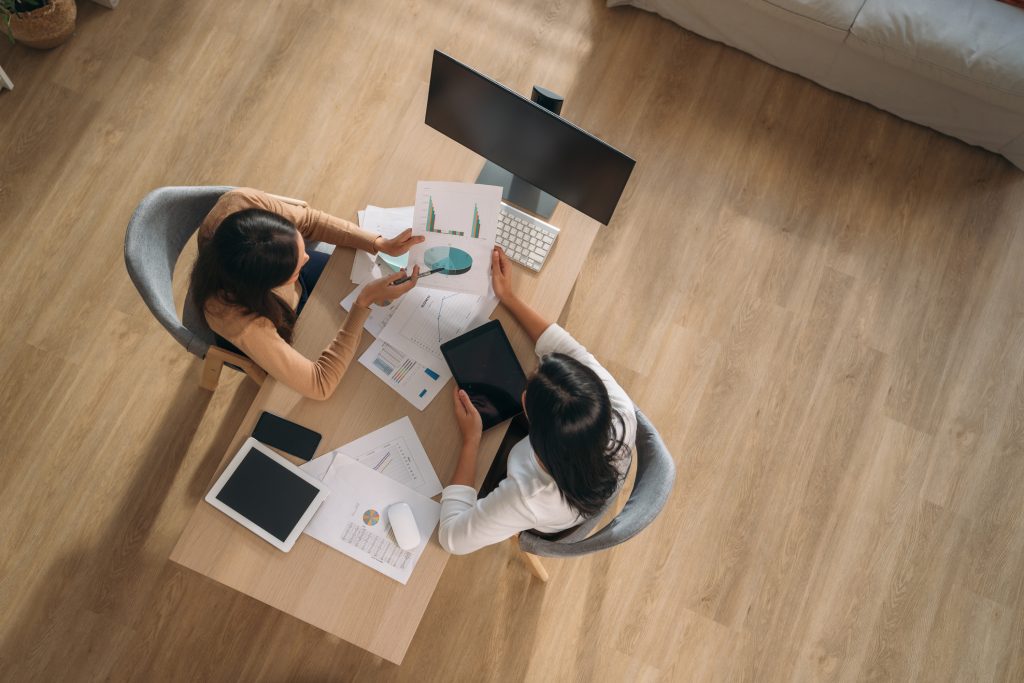 two women in publishing working at desk