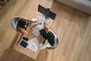 two women in publishing working at desk
