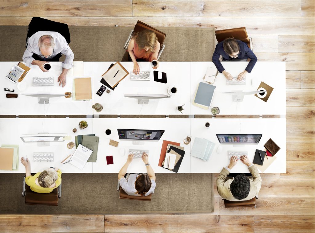 employees using AI tools and research to perform corporate strategies