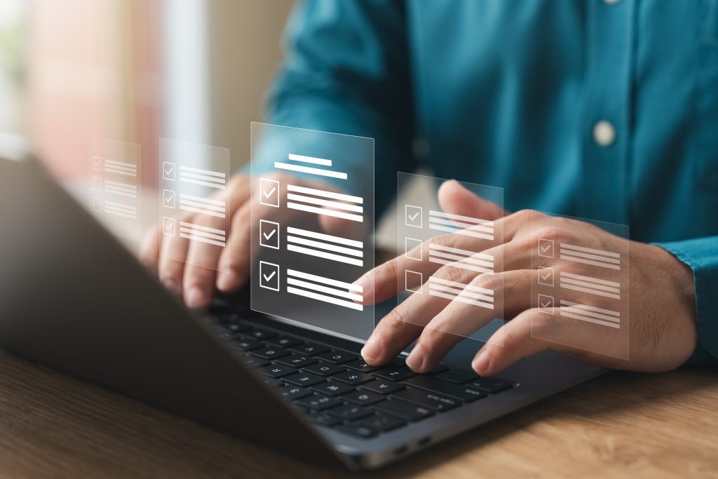 businessman using a laptop. online survey with digital forms and checklists. technology and strategy for success in the business modern world. efficiency, Transparency in organizations and companies